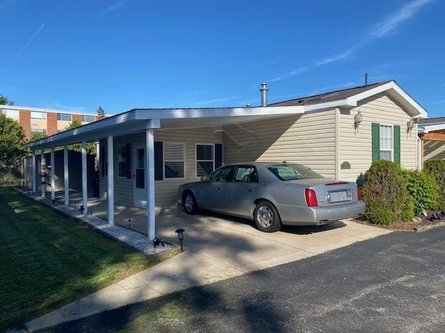 831 Douglas Dr, Erie, PA 16505 - view of side of home with an attached carport and driveway
