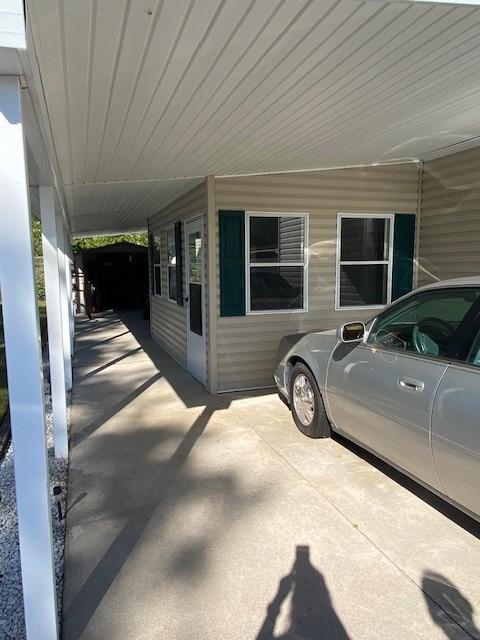 831 Douglas Dr, Erie, PA 16505 - view of side of property with a carport