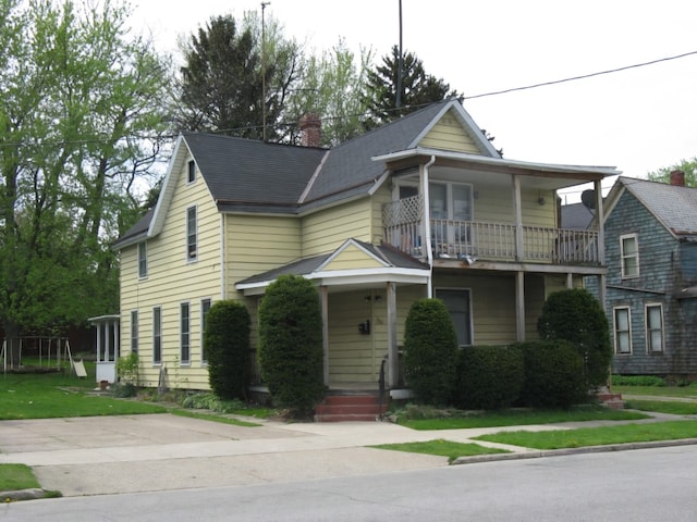 443 E 27 Th St, Erie, PA 16504 - victorian house featuring a chimney and a balcony