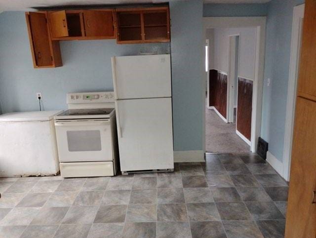 443 E 27 Th St, Erie, PA 16504 - kitchen with baseboards, open shelves, white appliances, and light countertops