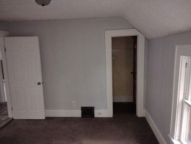 443 E 27 Th St, Erie, PA 16504 - unfurnished bedroom featuring dark carpet, vaulted ceiling, visible vents, a closet, and baseboards