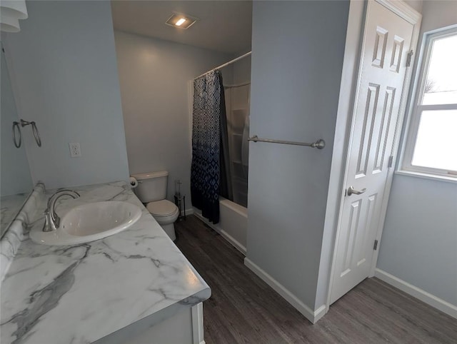 full bathroom featuring hardwood / wood-style floors, vanity, and a wealth of natural light