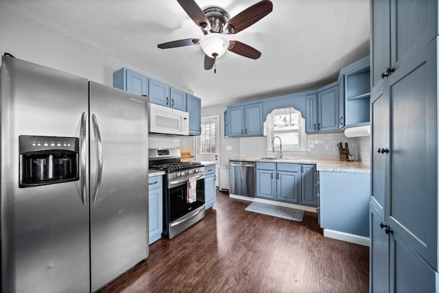 kitchen with blue cabinets, open shelves, stainless steel appliances, and dark wood-type flooring