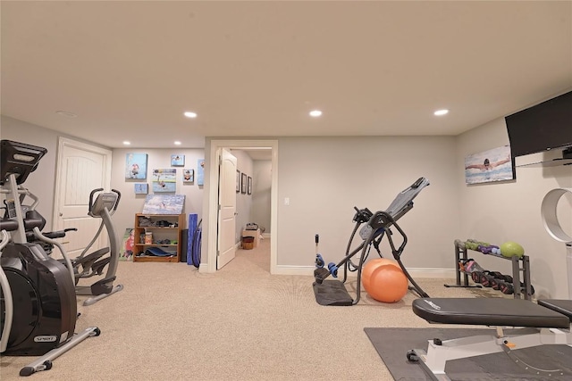 workout room featuring light colored carpet