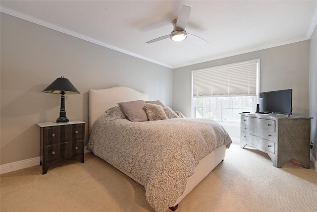 bedroom with ceiling fan, crown molding, and light colored carpet