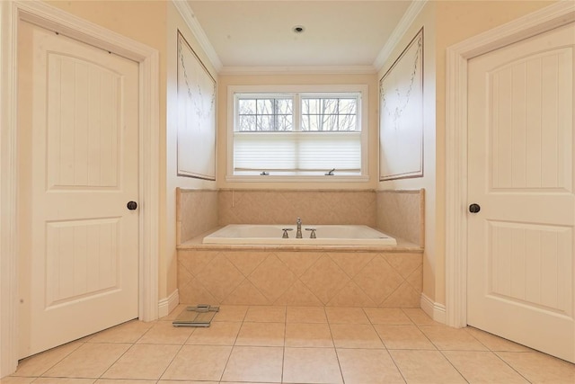 bathroom featuring tile patterned floors, crown molding, and a relaxing tiled tub