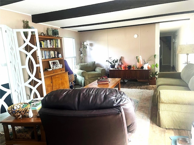 living room with hardwood / wood-style flooring and beamed ceiling