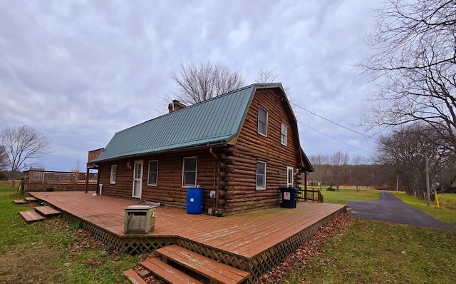 exterior space featuring a wooden deck