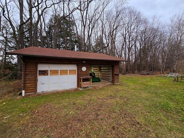 garage with a yard