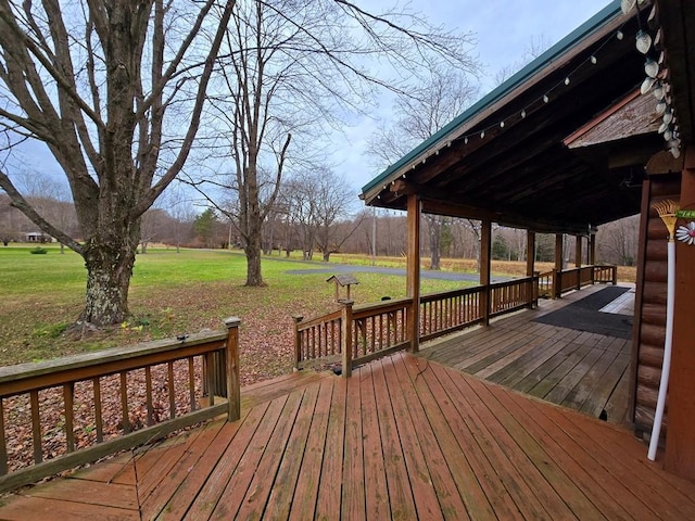 deck featuring a lawn