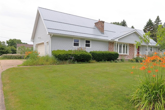 5219 W 52nd St, Fairview, PA 16415 - view of side of home with a garage, a chimney, a yard, concrete driveway, and a metal roof