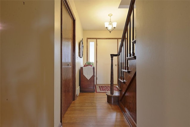5219 W 52nd St, Fairview, PA 16415 - corridor featuring a chandelier, wood finished floors, and stairway