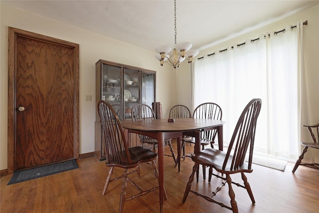 5219 W 52nd St, Fairview, PA 16415 - dining area with wood finished floors and a chandelier