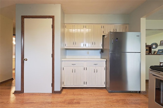 5219 W 52nd St, Fairview, PA 16415 - kitchen featuring appliances with stainless steel finishes, light countertops, and light wood-type flooring