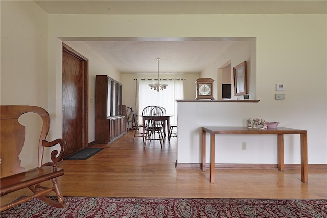 5219 W 52nd St, Fairview, PA 16415 - dining space with wood finished floors and a chandelier