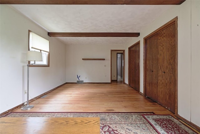 5219 W 52nd St, Fairview, PA 16415 - empty room with light wood-style flooring and beamed ceiling