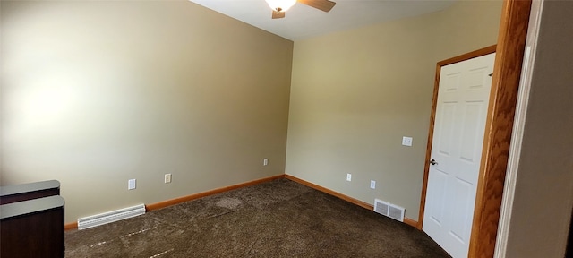 carpeted spare room with a ceiling fan, baseboards, and visible vents