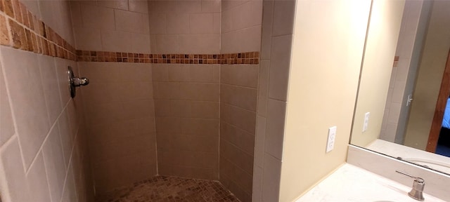 full bathroom featuring a sink and tiled shower