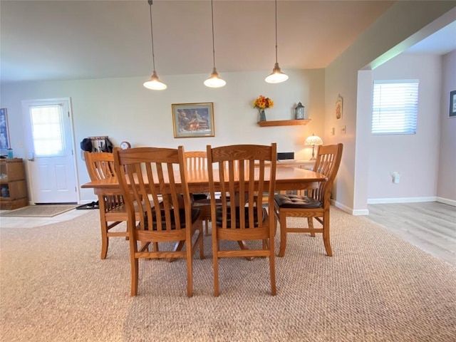 1986 Providence Dr, Jamestown, PA 16134 - dining room with light carpet, baseboards, and a healthy amount of sunlight