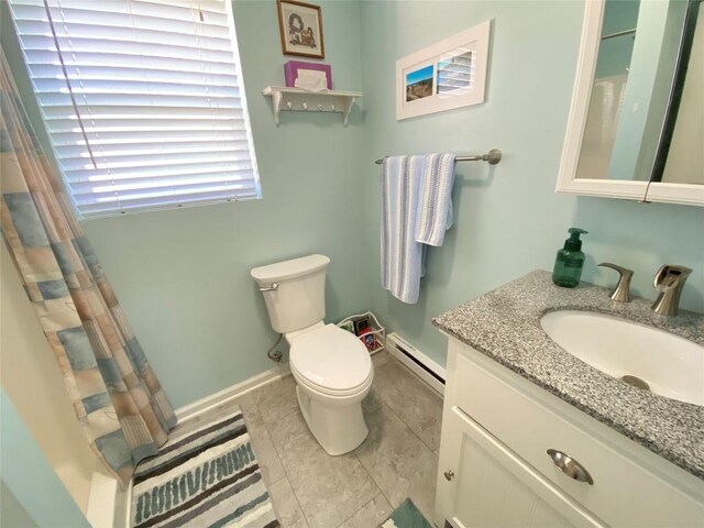 1986 Providence Dr, Jamestown, PA 16134 - bathroom with toilet, a shower with curtain, vanity, baseboard heating, and baseboards
