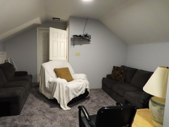 living room featuring carpet floors and lofted ceiling