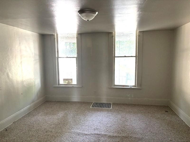 417 W 17th St, Erie, PA 16502 - empty room with carpet flooring and plenty of natural light