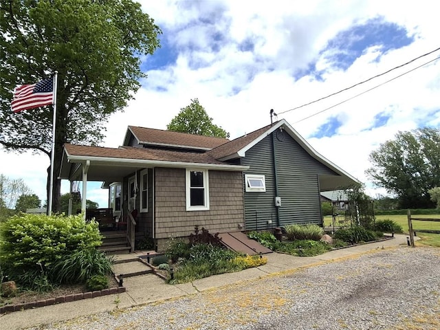 23754 S Beaver Rd, Springboro, PA 16435 - view of front of property featuring covered porch and roof with shingles