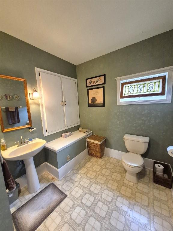 23754 S Beaver Rd, Springboro, PA 16435 - bathroom featuring toilet and baseboards