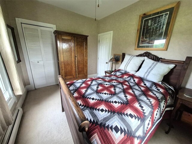 23754 S Beaver Rd, Springboro, PA 16435 - bedroom with a baseboard radiator, light colored carpet, and a closet