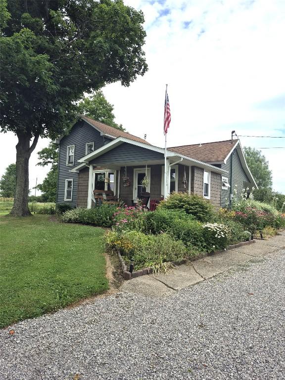 23754 S Beaver Rd, Springboro, PA 16435 - view of front of property featuring a front yard and a porch