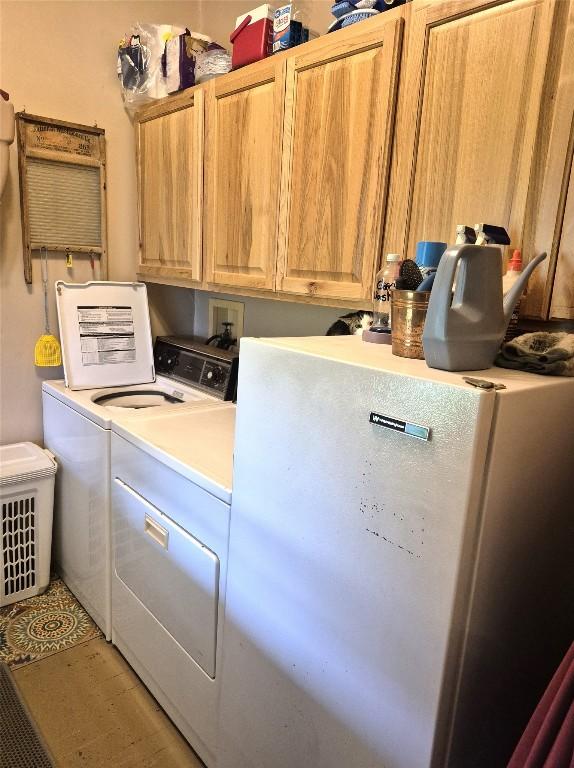 23754 S Beaver Rd, Springboro, PA 16435 - laundry room featuring washing machine and dryer and cabinet space
