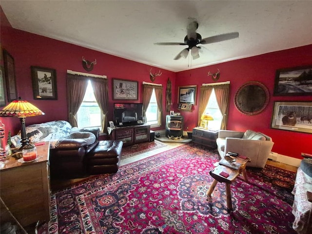 23754 S Beaver Rd, Springboro, PA 16435 - living room featuring a ceiling fan and a wood stove