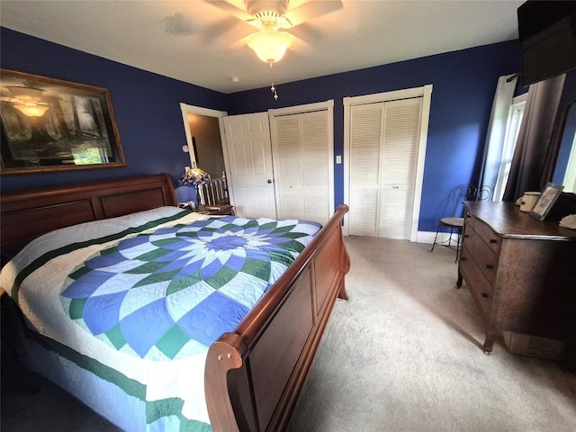23754 S Beaver Rd, Springboro, PA 16435 - carpeted bedroom featuring multiple closets and a ceiling fan