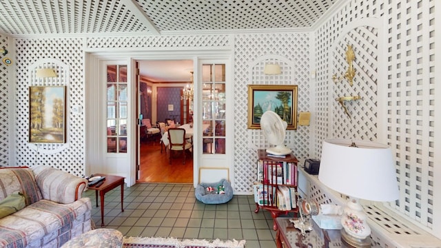 interior space with an inviting chandelier and ornamental molding