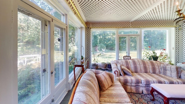 sunroom featuring french doors and a healthy amount of sunlight