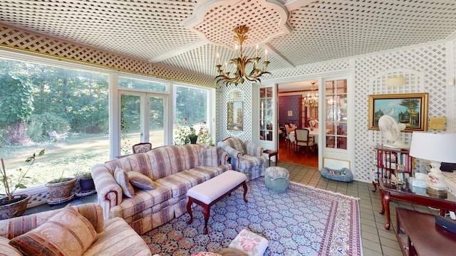 tiled living room featuring french doors and an inviting chandelier