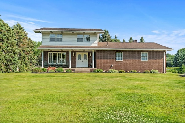 5124 W Ridge Rd, Erie, PA 16506 - traditional-style house featuring covered porch, a front yard, and brick siding
