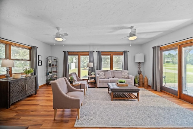 5124 W Ridge Rd, Erie, PA 16506 - living room featuring a ceiling fan, wood finished floors, and a textured ceiling