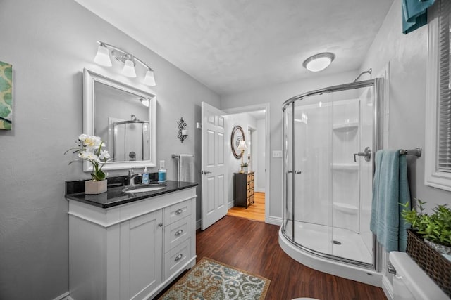 5124 W Ridge Rd, Erie, PA 16506 - full bathroom featuring a stall shower, vanity, and wood finished floors