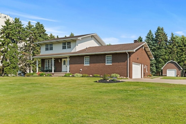 5124 W Ridge Rd, Erie, PA 16506 - traditional-style house featuring brick siding, a front lawn, covered porch, and a garage