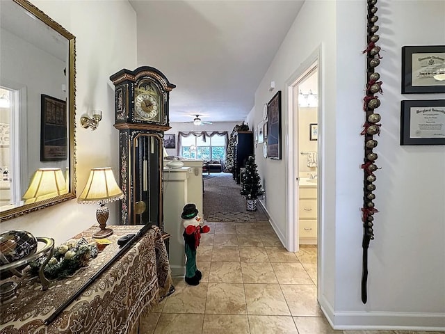 corridor featuring light tile patterned floors