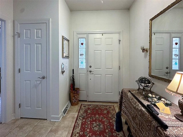 entryway featuring light tile patterned floors