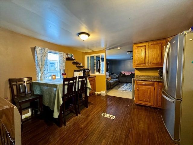 dining space with dark hardwood / wood-style floors