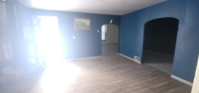 unfurnished room featuring hardwood / wood-style floors