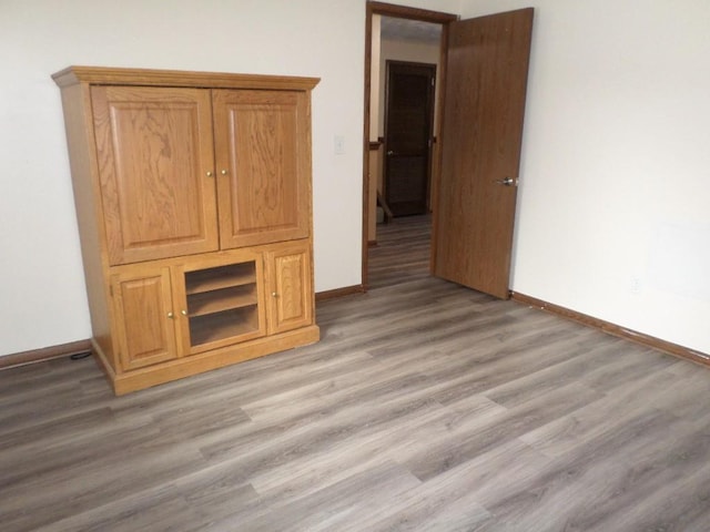 unfurnished bedroom with light wood-type flooring