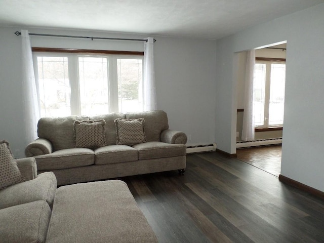 living room featuring a baseboard radiator and dark hardwood / wood-style floors