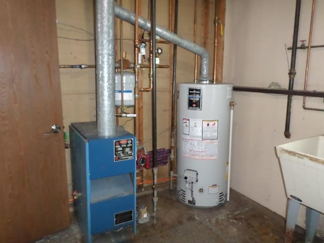 utilities featuring gas water heater and sink