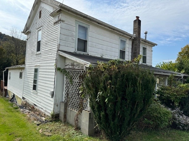 view of home's exterior featuring a lawn