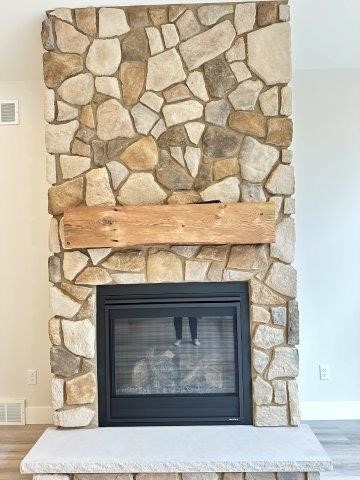 4655 Elsie Rd Unit 1, Erie, PA 16511 - detailed view of wood finished floors and a stone fireplace