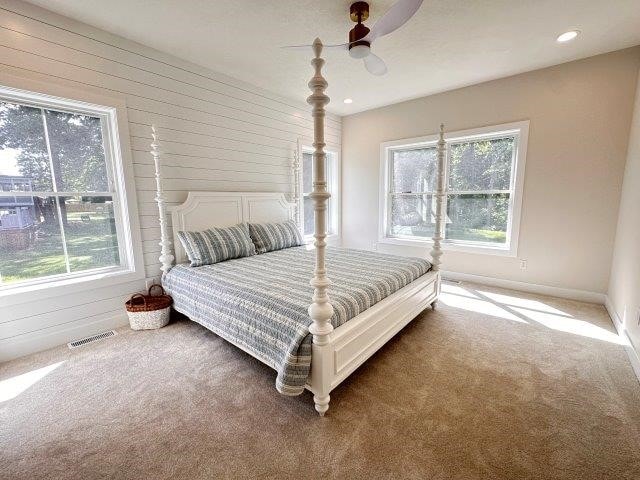 4655 Elsie Rd Unit 1, Erie, PA 16511 - carpeted bedroom featuring multiple windows, ceiling fan, and recessed lighting